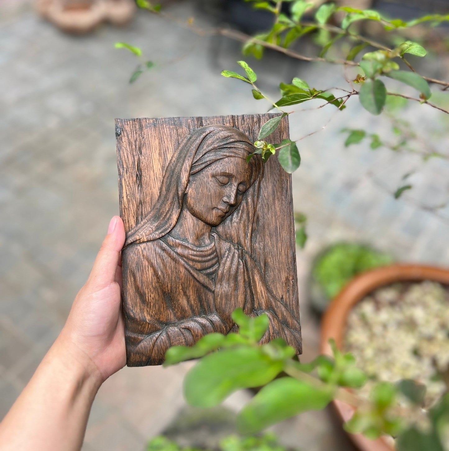 Wood carving of the Virgin Mary in prayer | The icon of the Virgin Mary in prayer